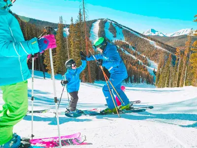 a group of people on skis in the snow at Timbers 3077 in Keystone
