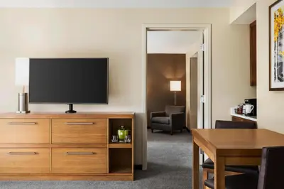 a hotel room with a flat screen tv on a dresser at Hyatt Place Keystone - Dillon in Keystone