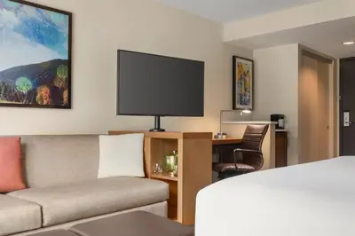 a living room with a couch and a tv at Hyatt Place Keystone - Dillon in Keystone