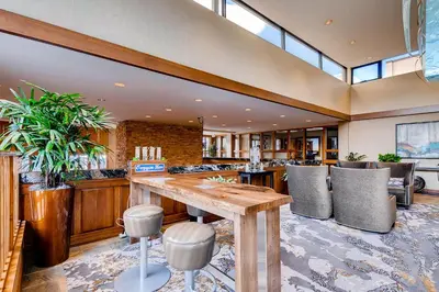 a large room with a wooden table and chairs at Keystone Lodge & Spa, A Vail Resorts Property in Keystone