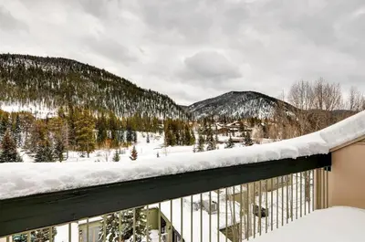 a snow covered balcony with a view of a mountain at Keystone Lodge & Spa, A Vail Resorts Property in Keystone