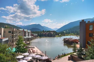 a view of a river in a town with mountains at Keystone Lodge & Spa, A Vail Resorts Property in Keystone