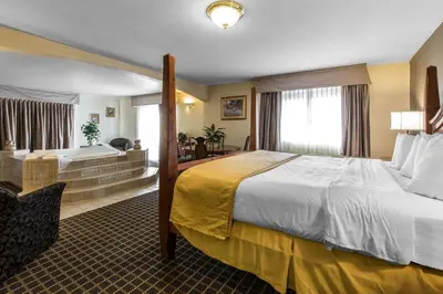 a hotel room with a large bed and a desk at Quality Inn and Suites Silverthorne - Copper Mountain in Silverthorne
