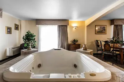 a large white bath tub in a living room at Quality Inn and Suites Silverthorne - Copper Mountain in Silverthorne