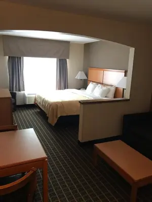 a hotel room with a bed and a window at Quality Inn and Suites Silverthorne - Copper Mountain in Silverthorne