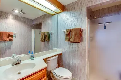 a bathroom with a toilet and a sink and a shower at Lakeview Marina Place in Dillon