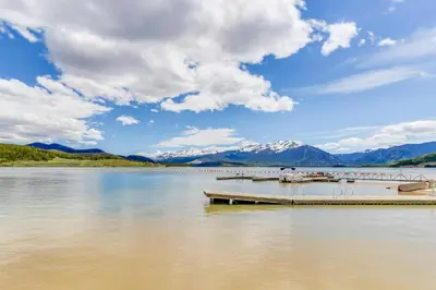 a boat is docked at a dock on a lake at Lakeview Marina Place in Dillon