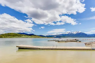 a dock on a lake with mountains in the background at Lakeview Marina Place in Dillon