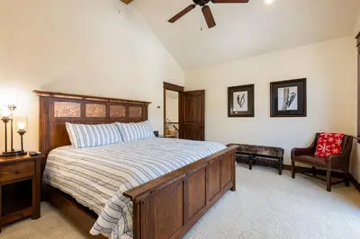 a bedroom with a bed and a ceiling fan at 47B River Run Townhomes in Keystone