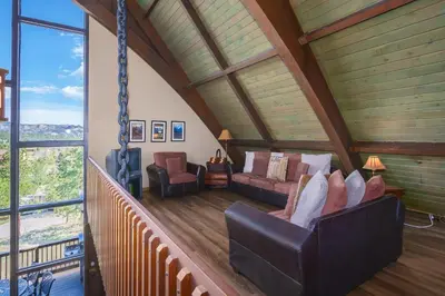 a living room with a swing in a house at Sky View in the Rockies in Estes Park
