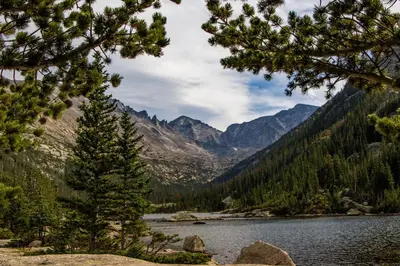 a view of a river in a valley with mountains at Sky View in the Rockies in Estes Park