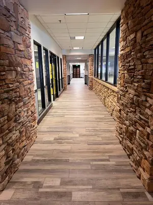 a hallway of a building with a brick wall at Silverado II in Winter Park