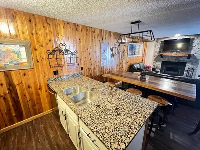 a kitchen with a sink and a counter top at Silverado II in Winter Park