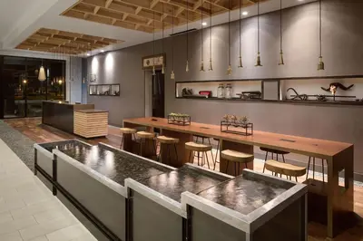 a large kitchen with a large table and chairs at Doubletree By Hilton Greeley At Lincoln Park in Greeley