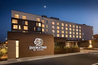 a rendering of the dothridge my hotel at night at Doubletree By Hilton Greeley At Lincoln Park in Greeley