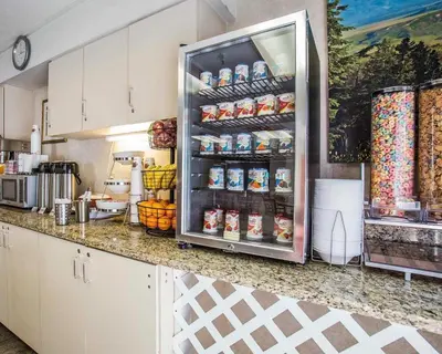 a kitchen with a refrigerator full of food at Econo Lodge Denver International Airport in Aurora