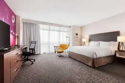 a hotel room with a bed and a desk at Hilton Garden Inn Boulder in Boulder