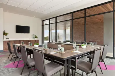 a conference room with a large table and chairs at Hilton Garden Inn Boulder in Boulder