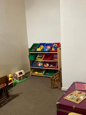 a childs play room with toy bins and toys at Hideaway Mountain Lodge in Fraser