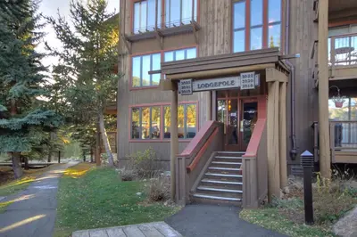 a building with a staircase in front of it at 2019 Lodgepole Condo in Keystone
