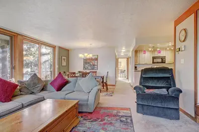 a living room with a couch and two chairs at 2019 Lodgepole Condo in Keystone