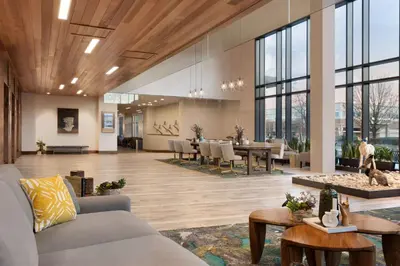 a living room with a couch and a table at Embassy Suites By Hilton Boulder in Boulder