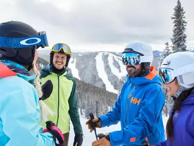 a group of people standing on top of a ski slope at Black Bear 8078 in Keystone