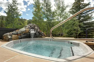 a hot tub with a water fountain at Black Bear 8078 in Keystone