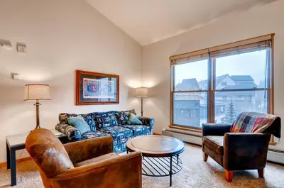 a living room with a couch and chairs and a table at Black Bear 8078 in Keystone