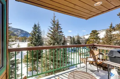 a balcony with a view of the snow covered mountains at Lenawee 1747 in Keystone