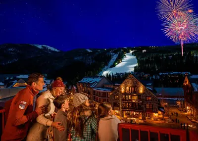 a group of people standing on a balcony watching fireworks at Lenawee 1747 in Keystone