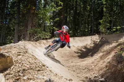 a person riding a dirt bike on a dirt road at Dakota Lodge 8513 in Keystone