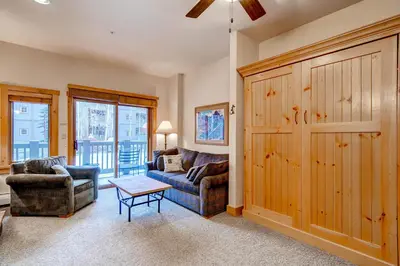 a living room with a couch and two chairs at Expedition Station 8566 in Keystone