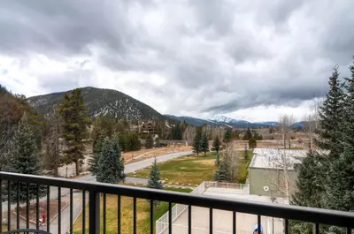 a view from the balcony of a resort with mountains at Plaza 1407 in Keystone