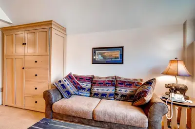 a living room with a couch and a table at Silver Mill 8289 in Keystone