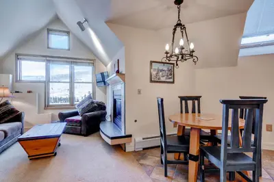 a living room with a table and a couch at Silver Mill 8289 in Keystone