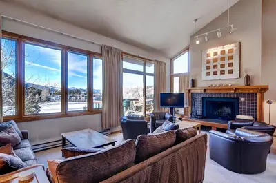 a living room with couches and a fireplace at Lenawee 1735 in Keystone
