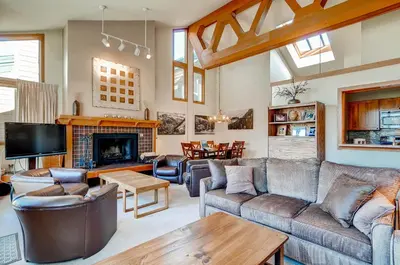 a living room with a couch and a fireplace at Lenawee 1735 in Keystone