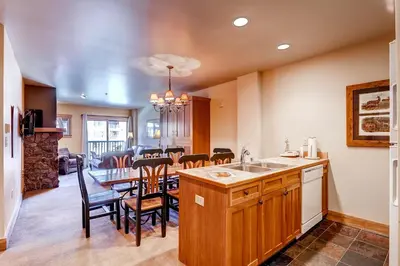 a kitchen and dining room with a table and chairs at Red Hawk 2272 in Keystone