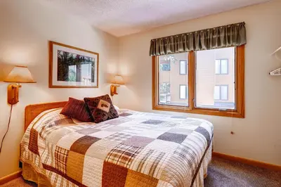 a bedroom with a bed and a window at Key Condo 2950 in Keystone