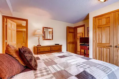 a bedroom with a bed and a dresser at Key Condo 2950 in Keystone