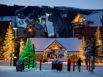 a ski lodge with a christmas tree in the snow at Key Condo 2950 in Keystone
