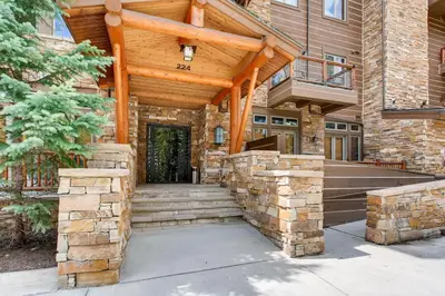 a wooden entrance to a building with a wooden roof at Timbers 3060 in Keystone