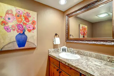 a bathroom with a sink and a mirror at Argentine 1525 in Keystone