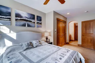 a bedroom with a bed and two paintings on the wall at Lone Eagle 3008 in Keystone