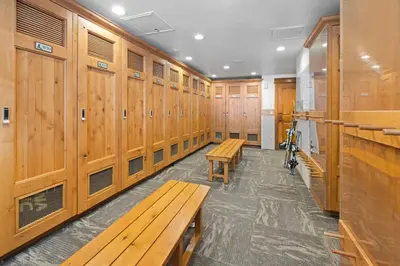 a row of wooden benches in a locker room at Lone Eagle 3008 in Keystone