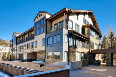an exterior view of a large apartment building at Slopeside 2741 in Keystone