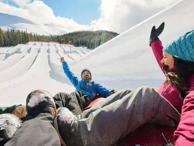 a group of people laying in the snow at Slopeside 2741 in Keystone
