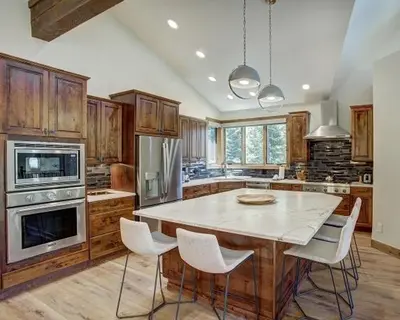 a large kitchen with a table and chairs in it at Settlers Creek 6466 in Keystone