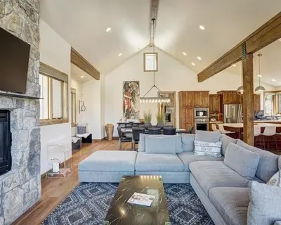 a living room with a couch and a fireplace at Settlers Creek 6466 in Keystone